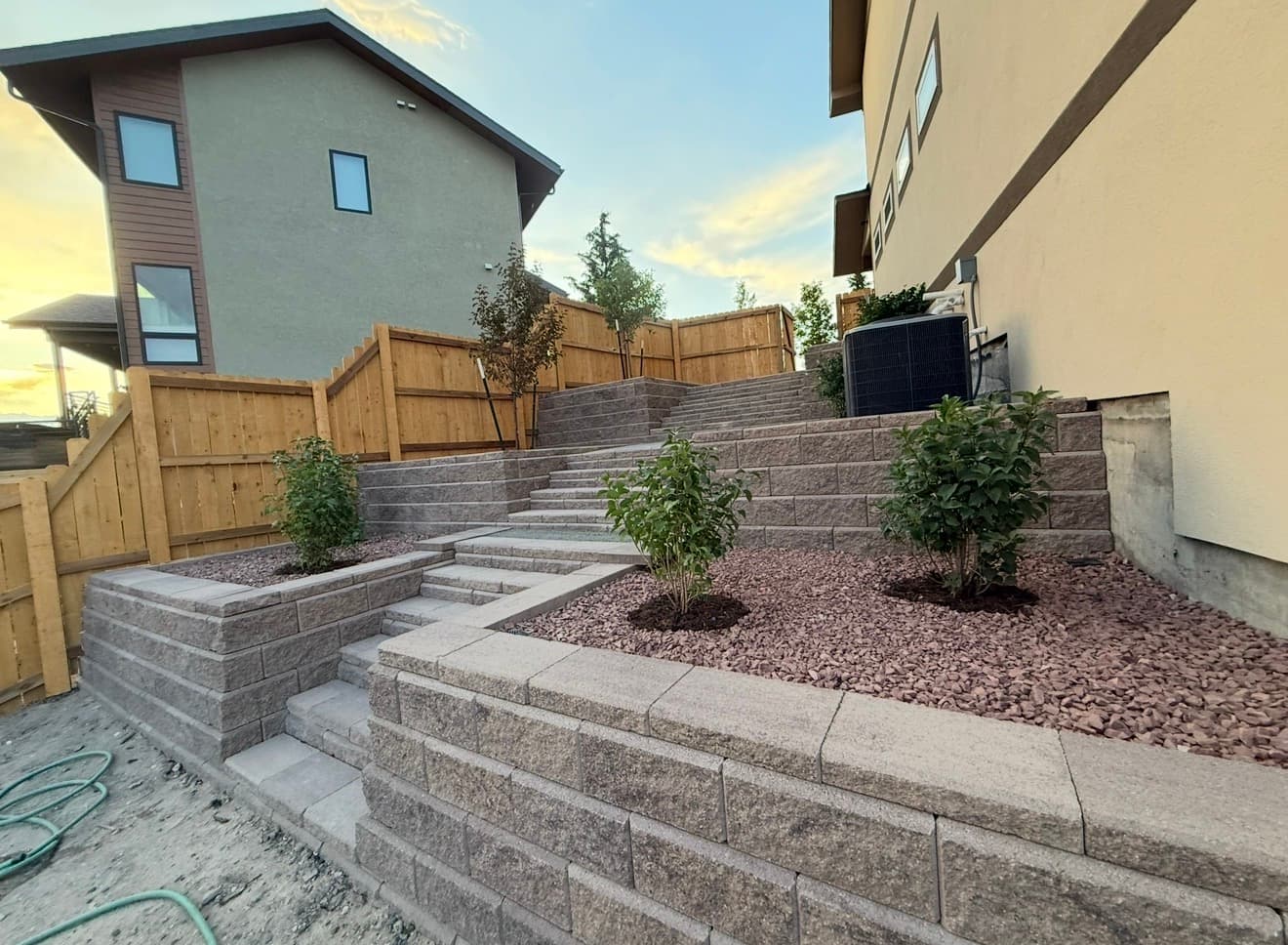 Cheyenne landscaping: tiered retaining walls, stone stairs, and planted beds by Jose and Juan’s Landscaping